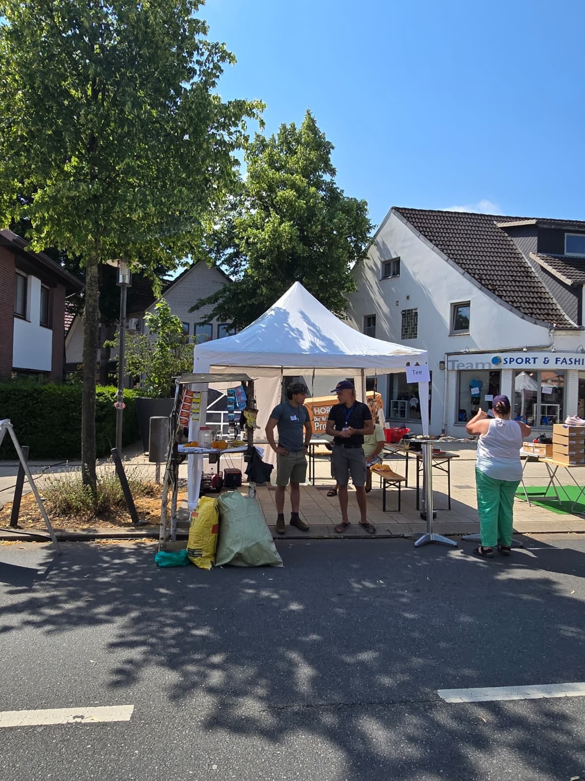 Information stand with gazebo and demo shop on the street at the summer festival