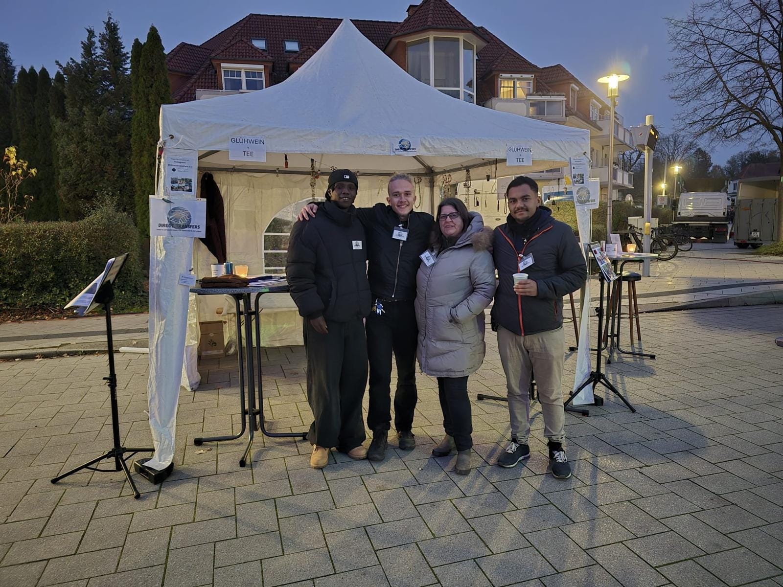 The team in front of the gazebo at the St Martin's festival in the evening