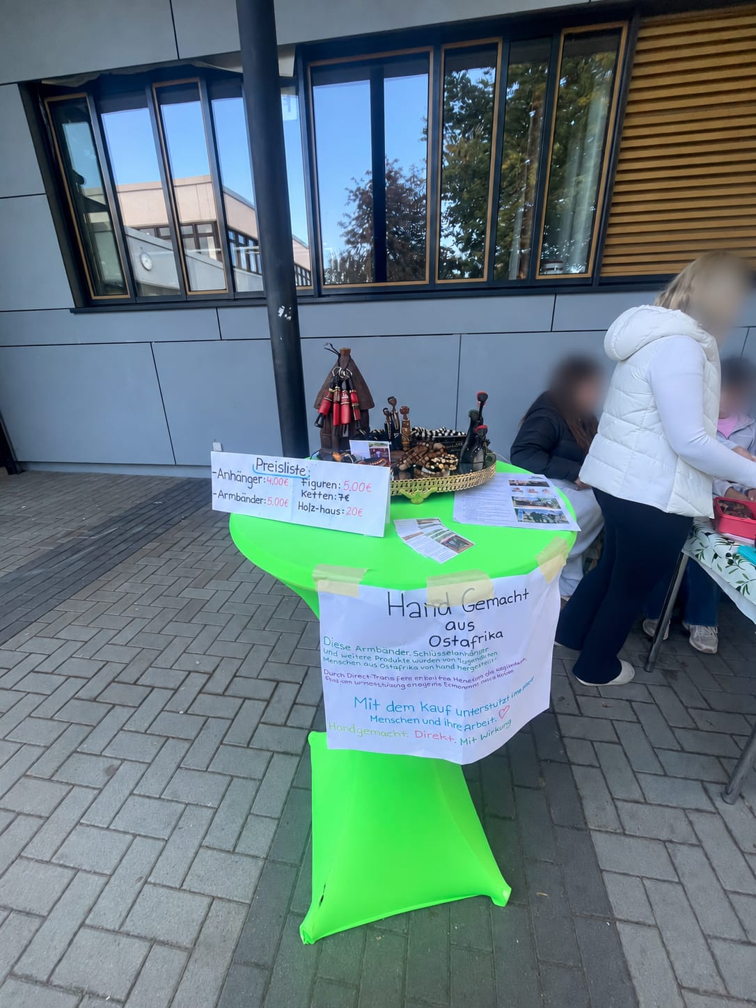 IGS Oyten sales stand with products and an information sign