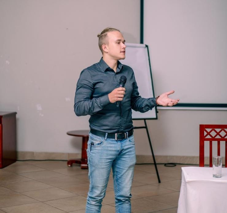 A board member giving a talk on unconditional cash transfers